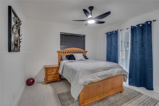 bedroom featuring baseboards and a ceiling fan