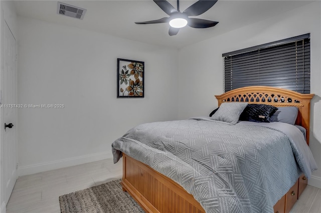 bedroom featuring baseboards, visible vents, and ceiling fan