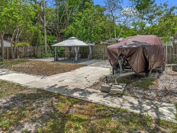 6444 Mcclellan St, Hollywood, FL 33024 - fenced backyard featuring a gazebo