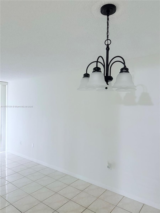 room details with baseboards and a textured ceiling