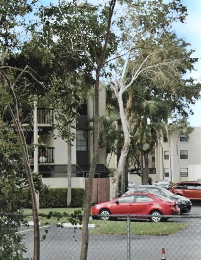 view of property featuring fence