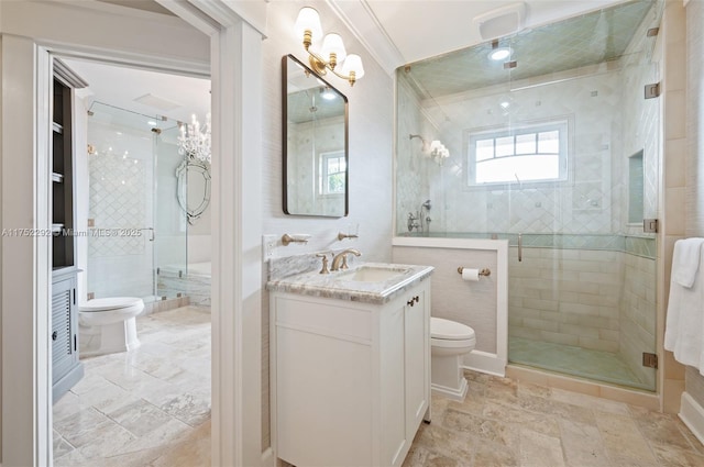 full bath featuring vanity, a shower stall, toilet, and crown molding