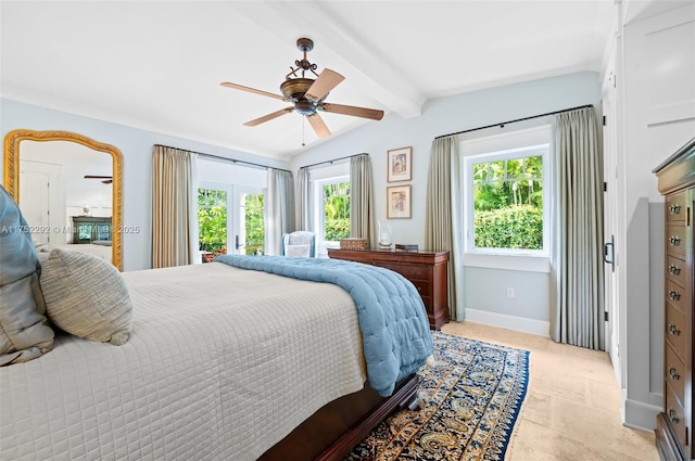 bedroom with lofted ceiling with beams, baseboards, and ceiling fan