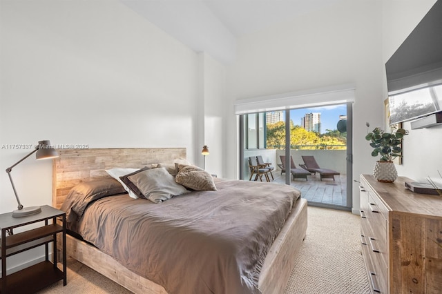 bedroom featuring access to outside and light colored carpet