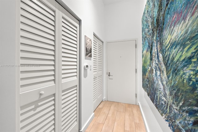 doorway featuring wood tiled floor