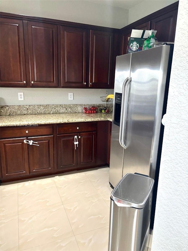 kitchen with stainless steel refrigerator with ice dispenser