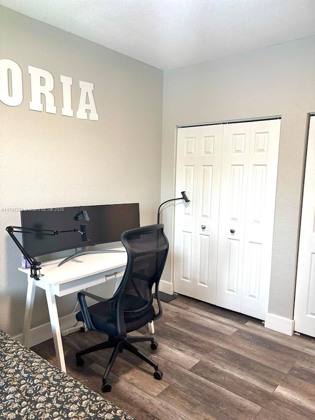 home office featuring wood finished floors and baseboards