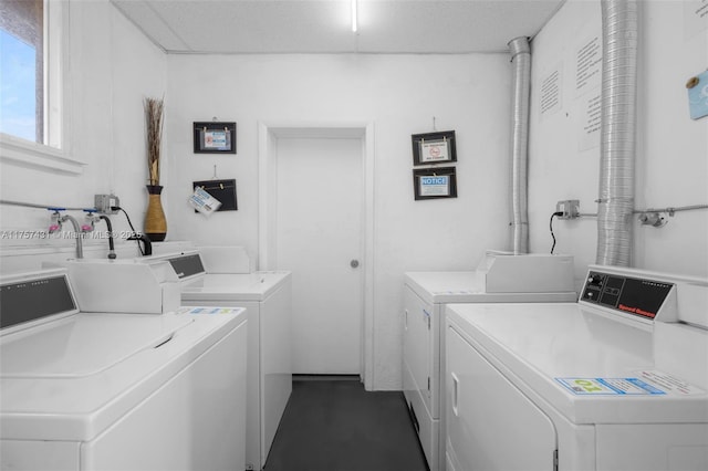 community laundry room with washer and dryer