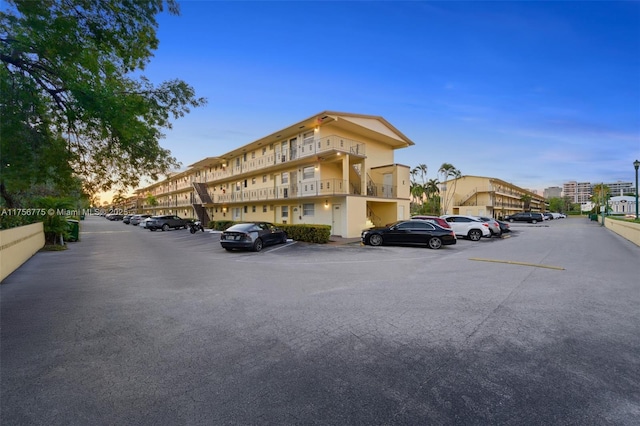 view of property featuring uncovered parking