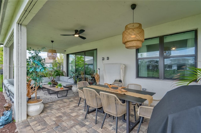 view of patio / terrace featuring ceiling fan, an outdoor living space, and outdoor dining space