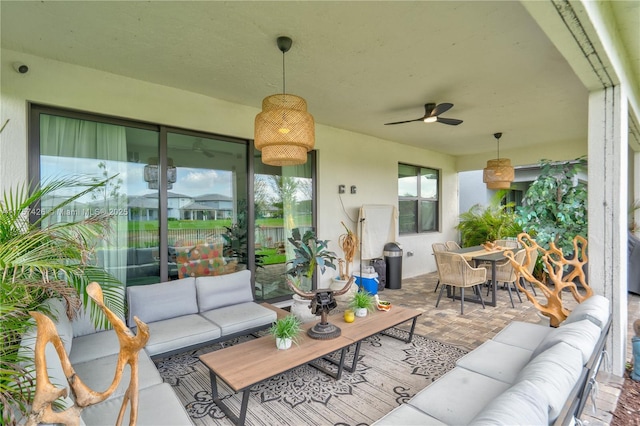 exterior space with ceiling fan, outdoor dining space, and an outdoor living space