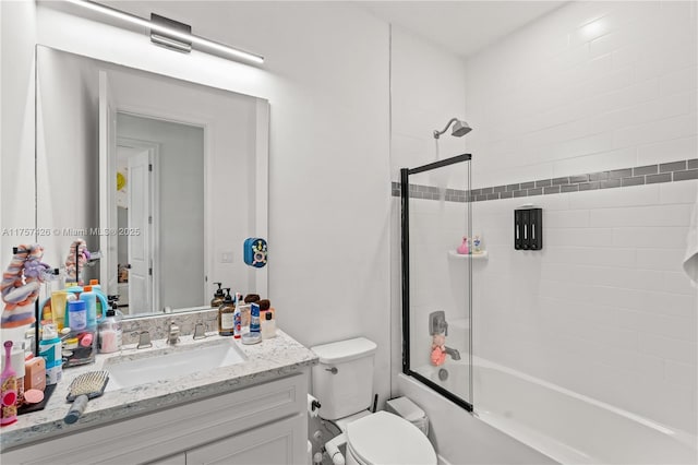 bathroom with toilet, shower / washtub combination, and vanity