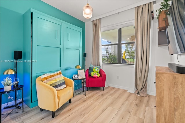 sitting room featuring wood finished floors and baseboards