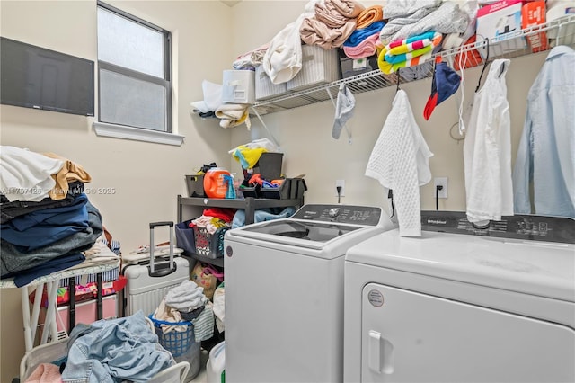 clothes washing area featuring laundry area and washing machine and dryer