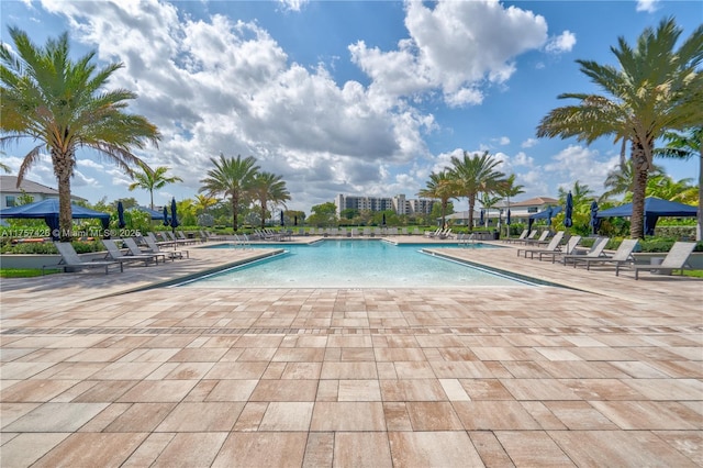 community pool featuring a gazebo and a patio