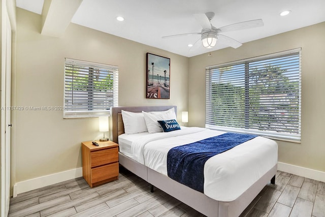 bedroom with wood finish floors, recessed lighting, a ceiling fan, and baseboards