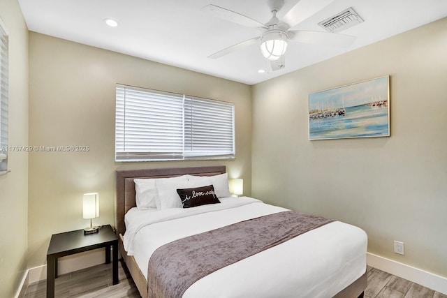 bedroom with baseboards, visible vents, ceiling fan, wood finished floors, and recessed lighting