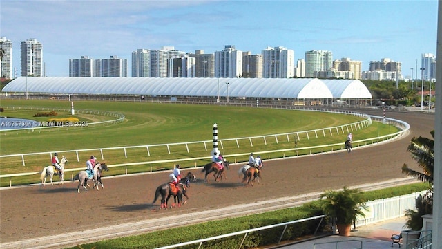 view of community featuring a view of city and an enclosed area