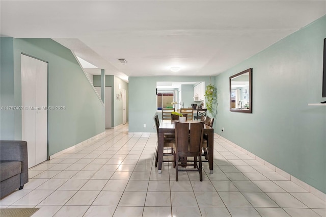 dining room featuring visible vents and light tile patterned floors