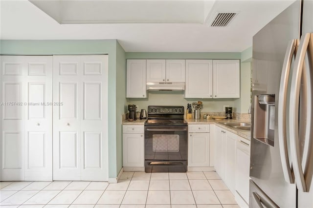 kitchen featuring light countertops, visible vents, black electric range oven, under cabinet range hood, and stainless steel fridge with ice dispenser