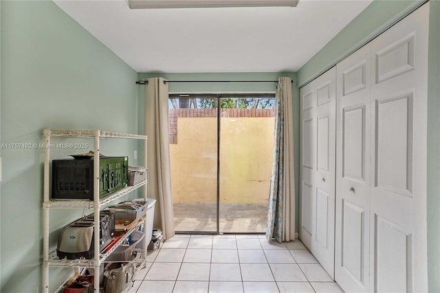 doorway with tile patterned floors