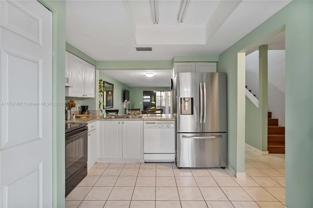 kitchen with stainless steel fridge, white cabinets, dishwasher, black electric range, and light tile patterned flooring