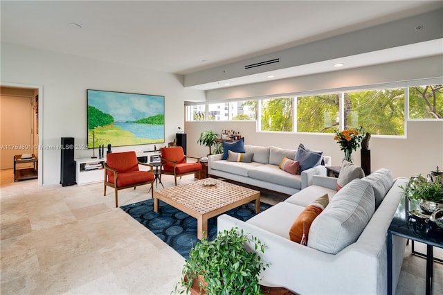 living area featuring recessed lighting and visible vents