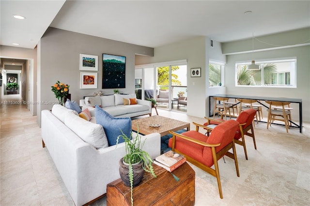 living room featuring recessed lighting and light tile patterned floors