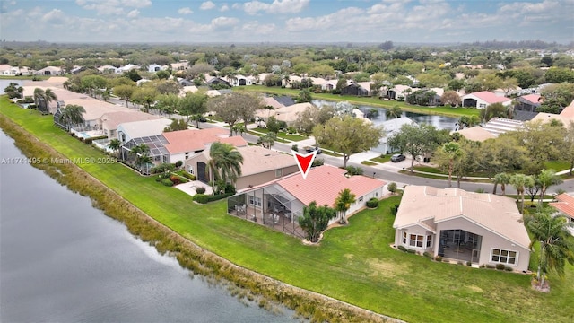 bird's eye view with a water view and a residential view