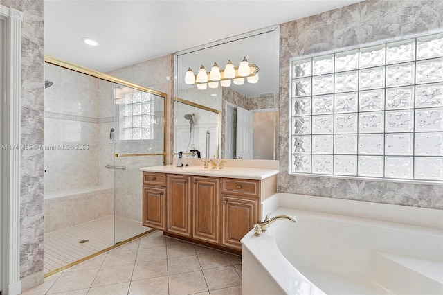 bathroom with tile patterned flooring, a healthy amount of sunlight, and a shower stall