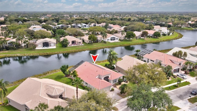 bird's eye view featuring a water view and a residential view