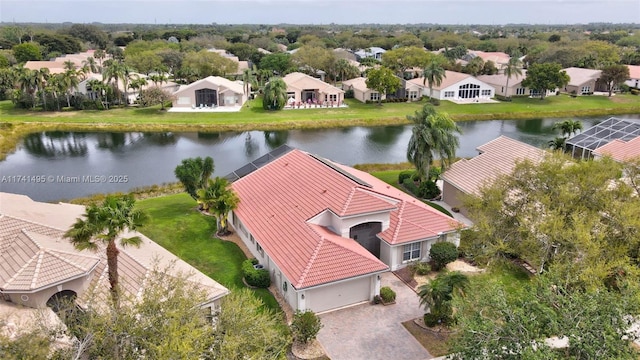 birds eye view of property with a water view and a residential view