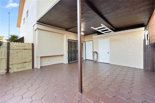 view of patio featuring fence