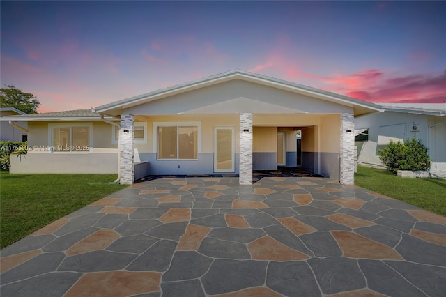 2927 NW 46th St, Tamarac, FL 33309 - view of front of home with stucco siding, a front yard, and a patio area