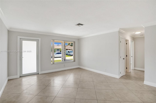 unfurnished room featuring ornamental molding, light tile patterned flooring, and visible vents