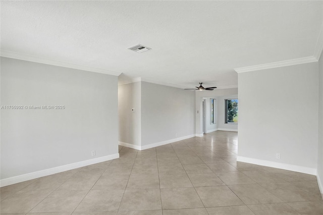 empty room with ceiling fan, light tile patterned floors, visible vents, baseboards, and ornamental molding