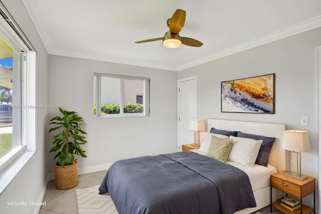 bedroom with multiple windows, crown molding, and baseboards