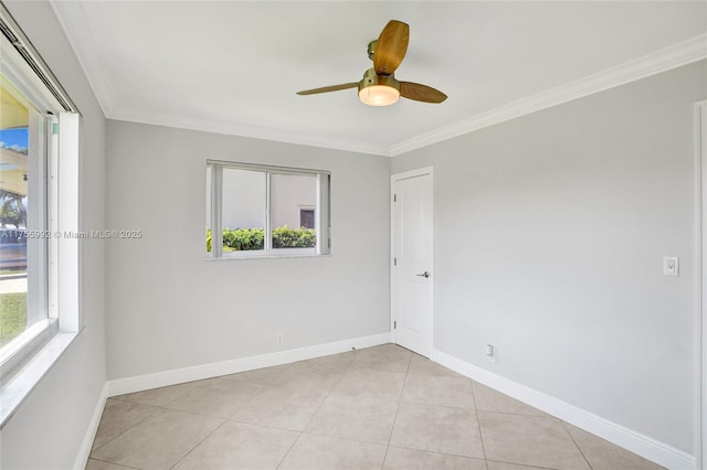 spare room featuring baseboards and crown molding