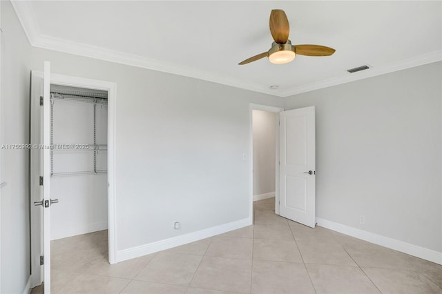 unfurnished bedroom with baseboards, visible vents, a closet, and ornamental molding