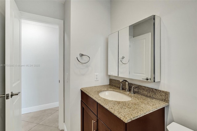 2927 NW 46th St, Tamarac, FL 33309 - half bathroom with vanity, tile patterned floors, baseboards, and toilet