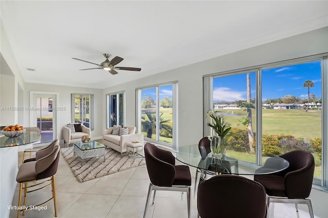 sunroom featuring a ceiling fan and visible vents