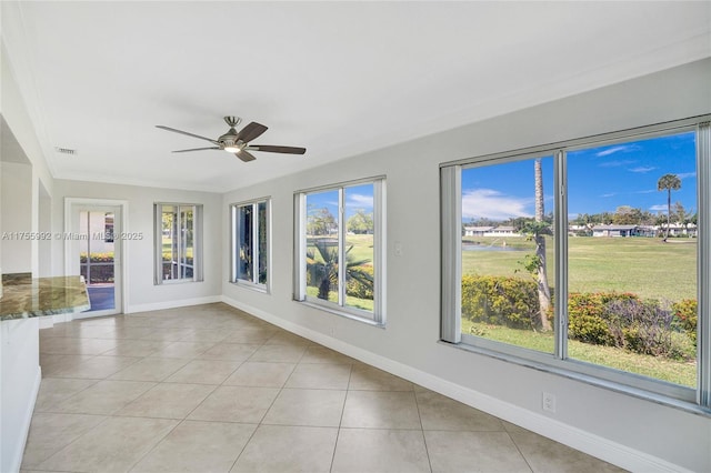 unfurnished sunroom with plenty of natural light, visible vents, and ceiling fan