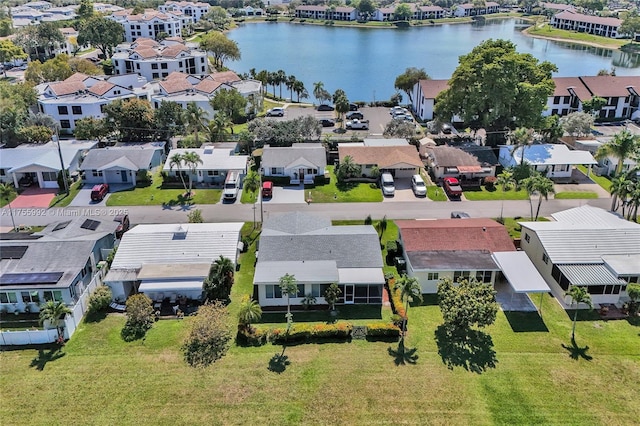 bird's eye view featuring a residential view and a water view