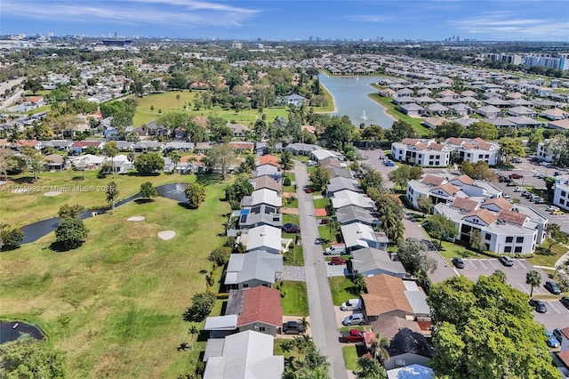 birds eye view of property featuring a water view and a residential view