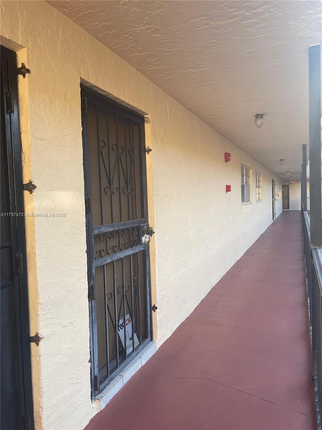 property entrance with stucco siding