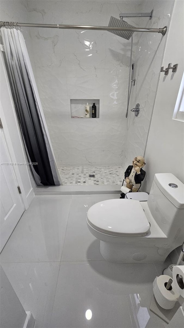 full bath with a shower with shower curtain, toilet, and tile patterned flooring