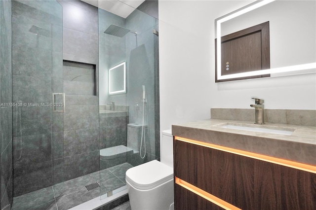 bathroom featuring a stall shower, vanity, and toilet