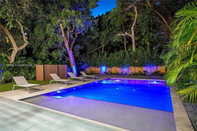 view of pool featuring a fenced in pool, fence, and a patio