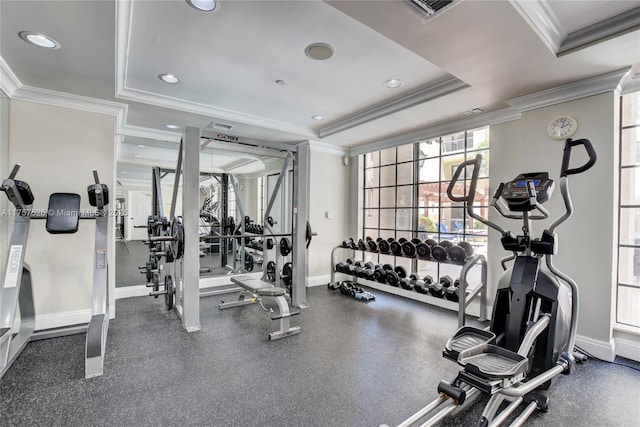 exercise room with recessed lighting, visible vents, baseboards, ornamental molding, and a tray ceiling