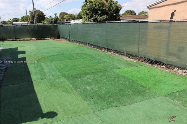 view of yard with a fenced backyard